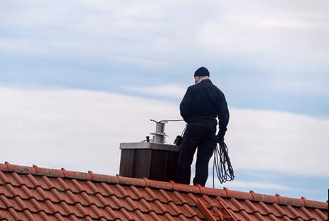 Rod rig running the flue from the roof